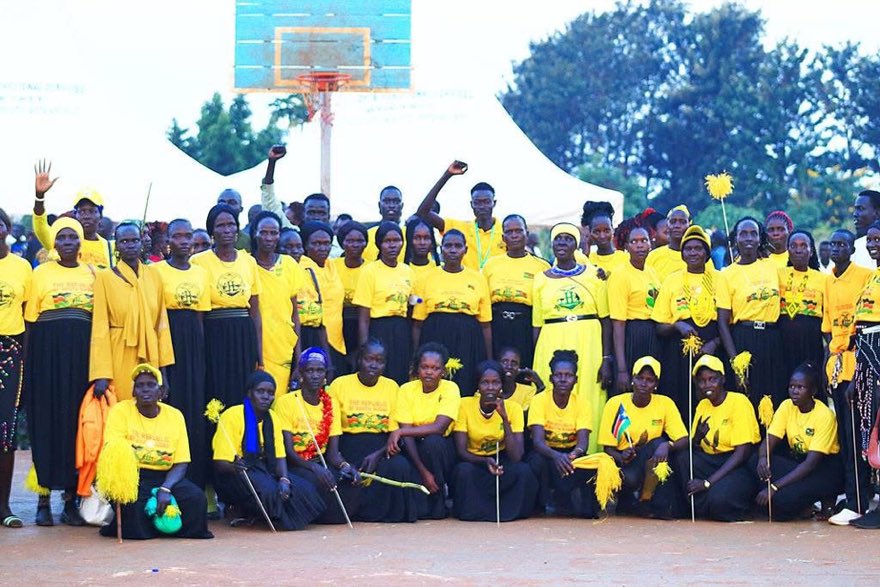 A large group of IfP-South Sudan volunteers and participants in yellow shirts gathered together at Peace Cultural Day
