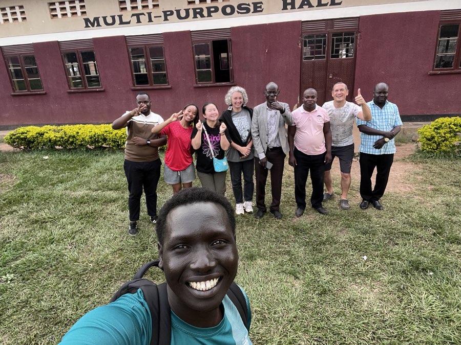 Founder Deng Aguer Bul with international supporters and team members